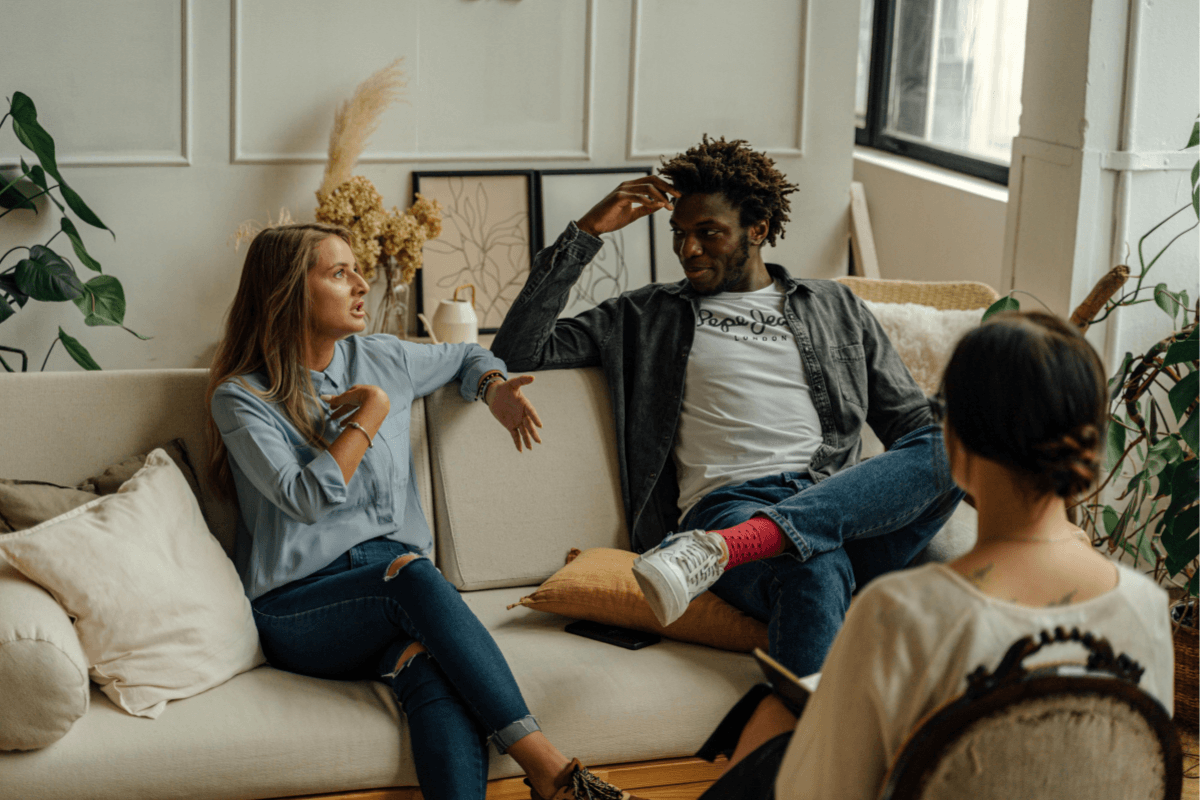 Couple talking with a counselor during a therapy session