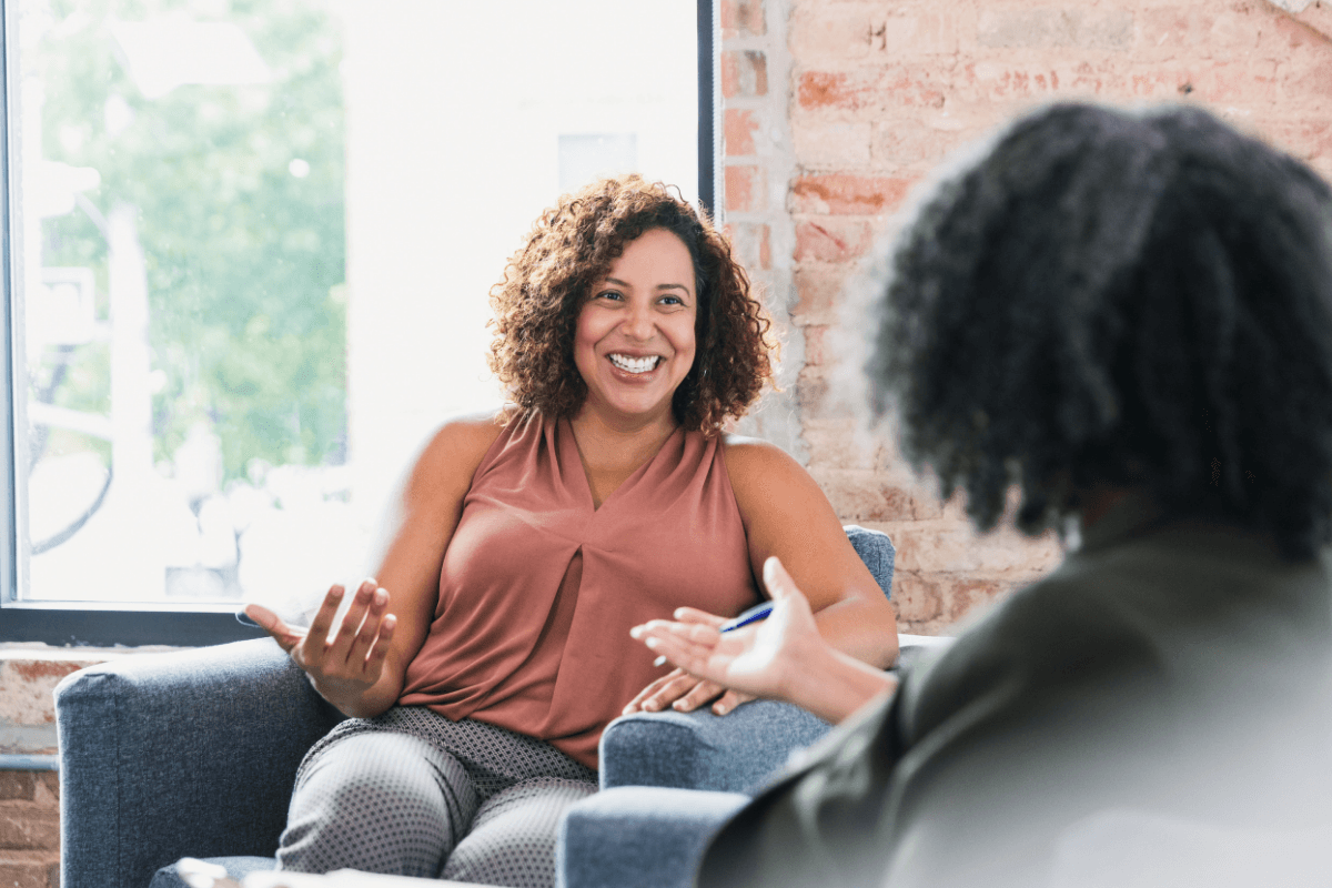 Therapist and client talking during a counseling session