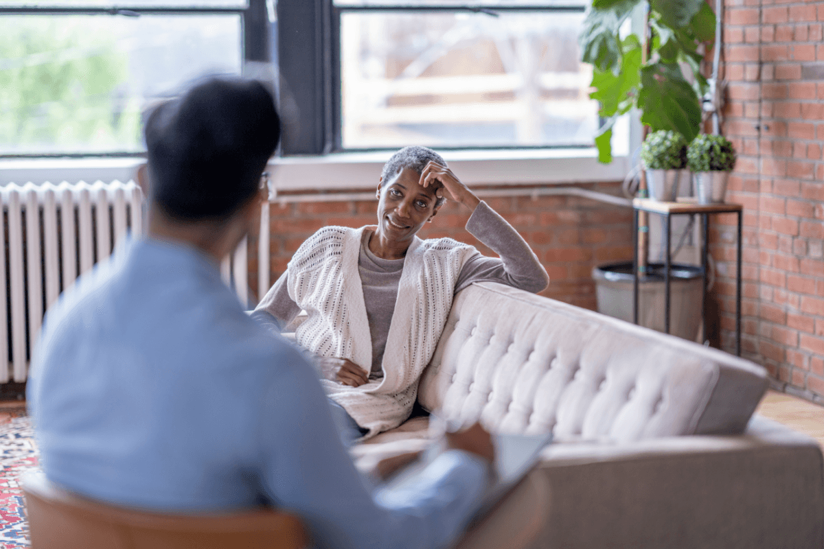 Therapist speaking with a patient during an individual therapy session